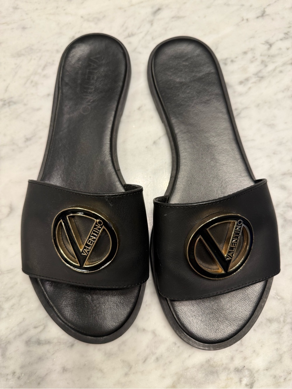 Valentino Women’s Black Leather Slide Sandals with Gold and Black Logo